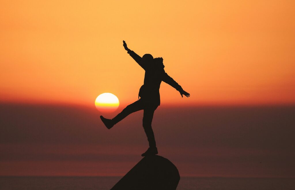 man infront of sunset