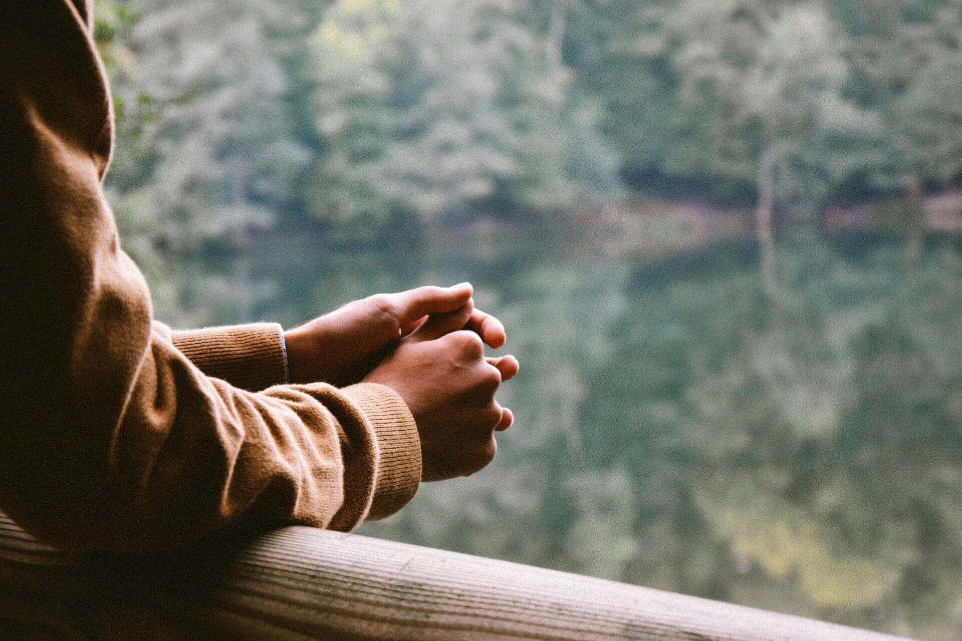 man-crossed-hand-on-ledge